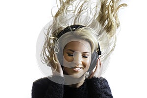 Pretty Girl Flinging Hair Listening Headphones Isolated Background