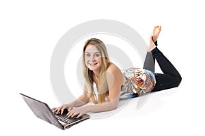 Pretty girl on floor with computer