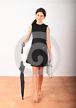 Pretty girl in formal dress with black umbrella and money case