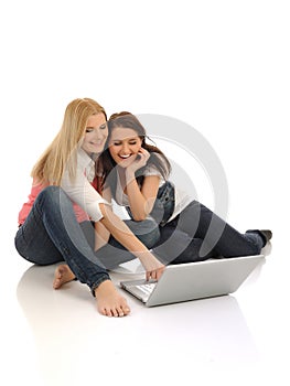 Pretty girl friends surfing in internet