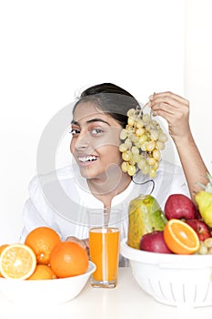 Pretty girl with fruits