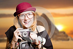 Pretty girl in glasses with camera on Egypt