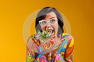 Pretty girl in glasses and snowdrops with funny emotions