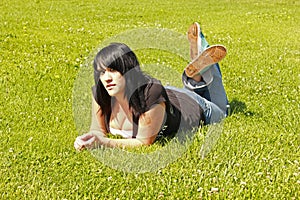 Pretty Girl On The Grass On Her Stomach