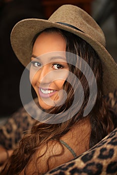 Pretty girl in hat looking over shoulder