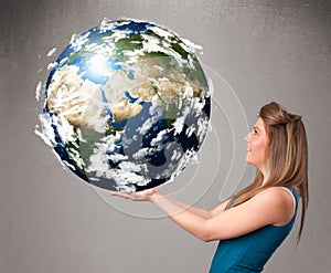 Pretty girl holding 3d planet earth