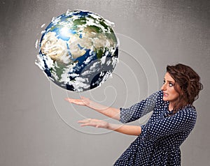 Pretty girl holding 3d planet earth