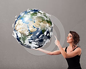 Pretty girl holding 3d planet earth