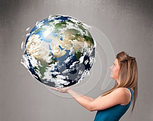 Pretty girl holding 3d planet earth