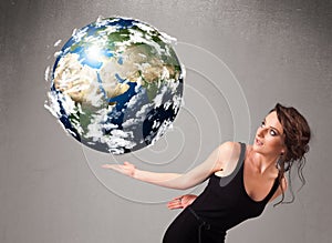 Pretty girl holding 3d planet earth
