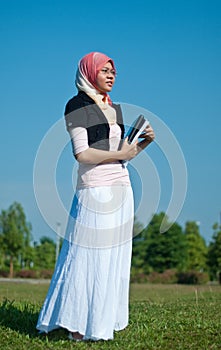 Pretty girl holding books