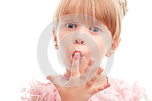 Pretty girl holding finger on her lips