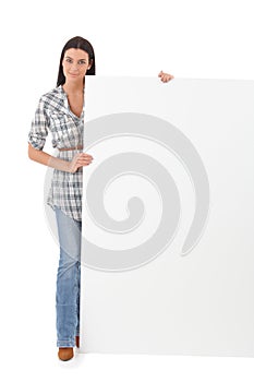 Pretty girl with huge blank sheet