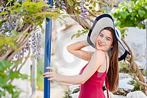 Pretty girl in idyllic greek garden