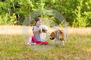 Pretty girl introducing her new pets together