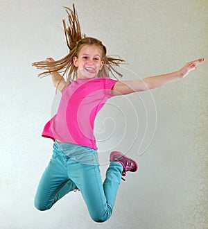 Pretty girl jumping high and dancing