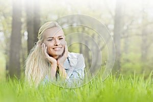 Pretty girl laying on grass