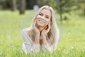 Pretty girl laying on grass