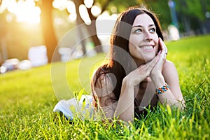 Pretty girl laying on the grass