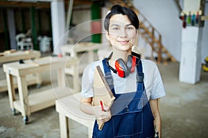 Pretty girl learning about carpentry