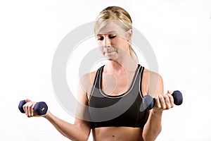 Pretty girl lifting two weights