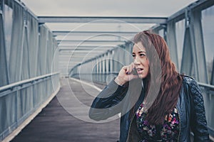 Pretty girl with long hair talking on phone