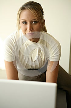 Pretty girl looking over computer