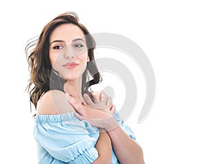 Pretty girl looks to camera, isolated on white background. Portrait of happy young woman. Front view of smiling female