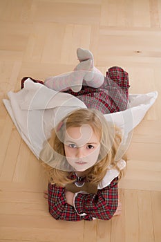 Pretty girl lying on the floor