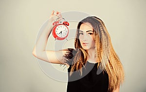 Pretty girl managing her time. Woman hold vintage alarm clock. Watch repair. Time management. Punctuality and discipline