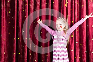 Pretty girl in pantomime costume on stage