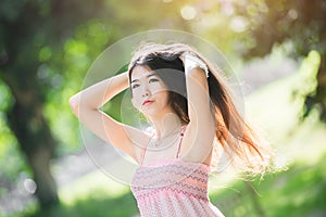 Pretty girl in the park with sunshine day