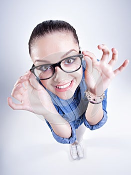 Pretty girl with perfect teeth wearing geek glasses smiling