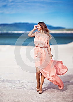 Pretty girl in pink silk dress