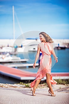 Pretty girl in pink silk dress