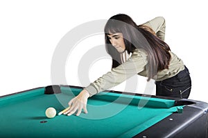 Pretty girl playing billiard