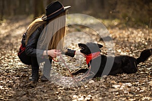 Pretty girl playing and having fun with her pet by name Brovko Vivchar