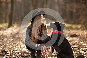 Pretty girl playing and having fun with her pet by name Brovko Vivchar