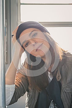 Pretty girl posing in a metro car