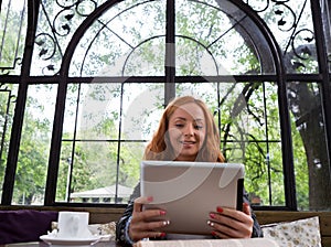 Pretty girl posing with a tablet