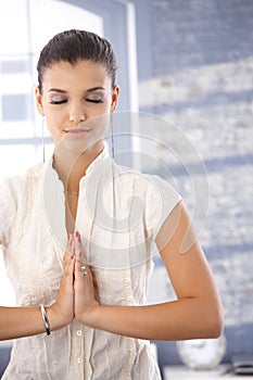 Pretty girl in prayer position