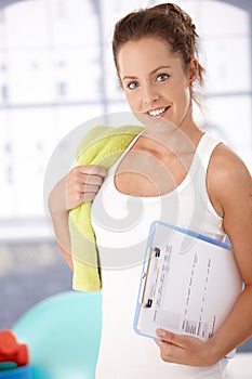 Pretty girl prepared for workout in gym