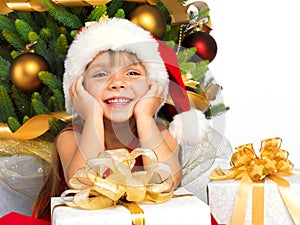 Pretty girl with present near the Cristmas tree