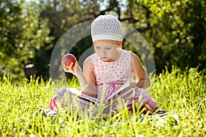 Pretty girl is reading a children's book