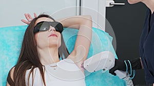 Pretty Girl Receives Laser Hair Removal Procedures In Beauty Studio