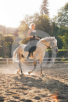 Pretty girl riding a horse