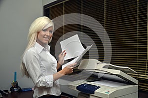 Pretty girl scans documents