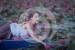 Pretty girl and the sea of red lotus