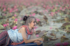 Pretty girl and the sea of red lotus