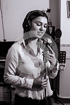 Pretty Girl Singing Into Studio Microphone.